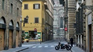 black motorcycle parked near pedestrian crossing