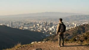 Traveller overlooking a city, planning their World Cup 2026 trip.