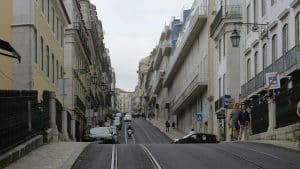 A street in lisbon with buildings on each side.