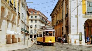 yellow and white tram on road during daytime