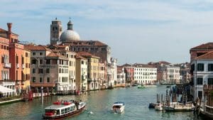 boats in a river with Grand Canal in the background