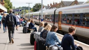 Train station platform with travellers heading to Silverstone.