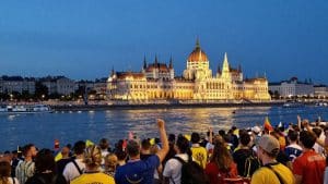 Budapest cityscape with football fans during Champions League Final.