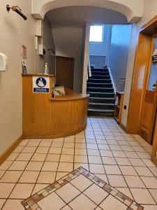 Lobby with staircase and reception desk at Manor Hotel Ballymoney, County Antrim