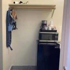 In-room kitchenette nook at National 9 Motel in Santa Cruz with microwave, mini-fridge and coffee maker