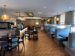 Restaurant at Cook's Bar and Kitchen with bar, tables and chairs at The Grange Manor in Grangemouth