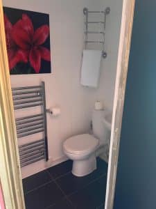 Refurbished bathroom at Keats Green Hotel, bath with overhead shower