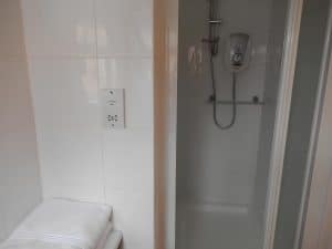 Private en-suite walk-in shower room at The Rutlands B&B with white modern tiling