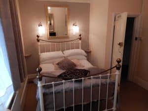 Attic double room at The Rutlands B&B with a velux window and partial castle view