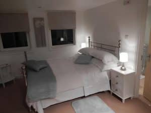 Calm double bedroom at The Rutlands B&B in soft Victorian-inspired tones