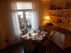 Breakfast table set with Royal Albert bone china in the dining room at The Rutlands B&B