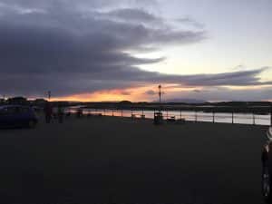 Sunset over the quayside and estuary at the regenerated harbourside, looking towards the hills, North Ayrshire