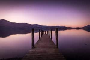 Ashness Jetty reaching into a still Derwentwater at dusk, Lake District