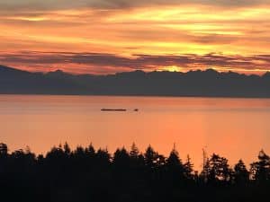 Sunset over the Salish Sea and the mainland mountains, seen from the property in North Nanaimo