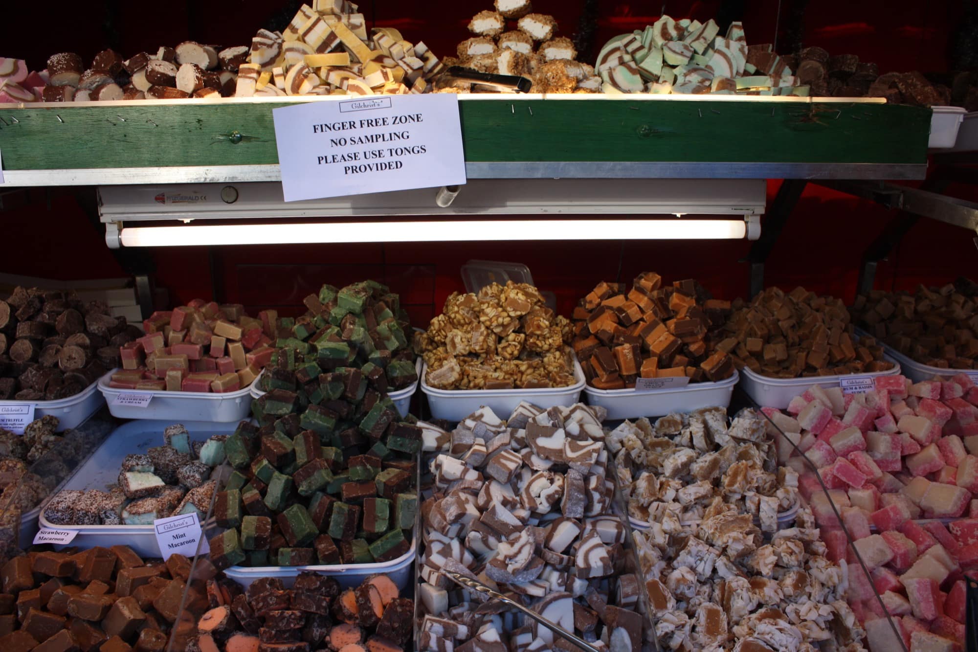 A confectionery stall at Belfast Christmas Market piled with fudge, nougat and Turkish delight