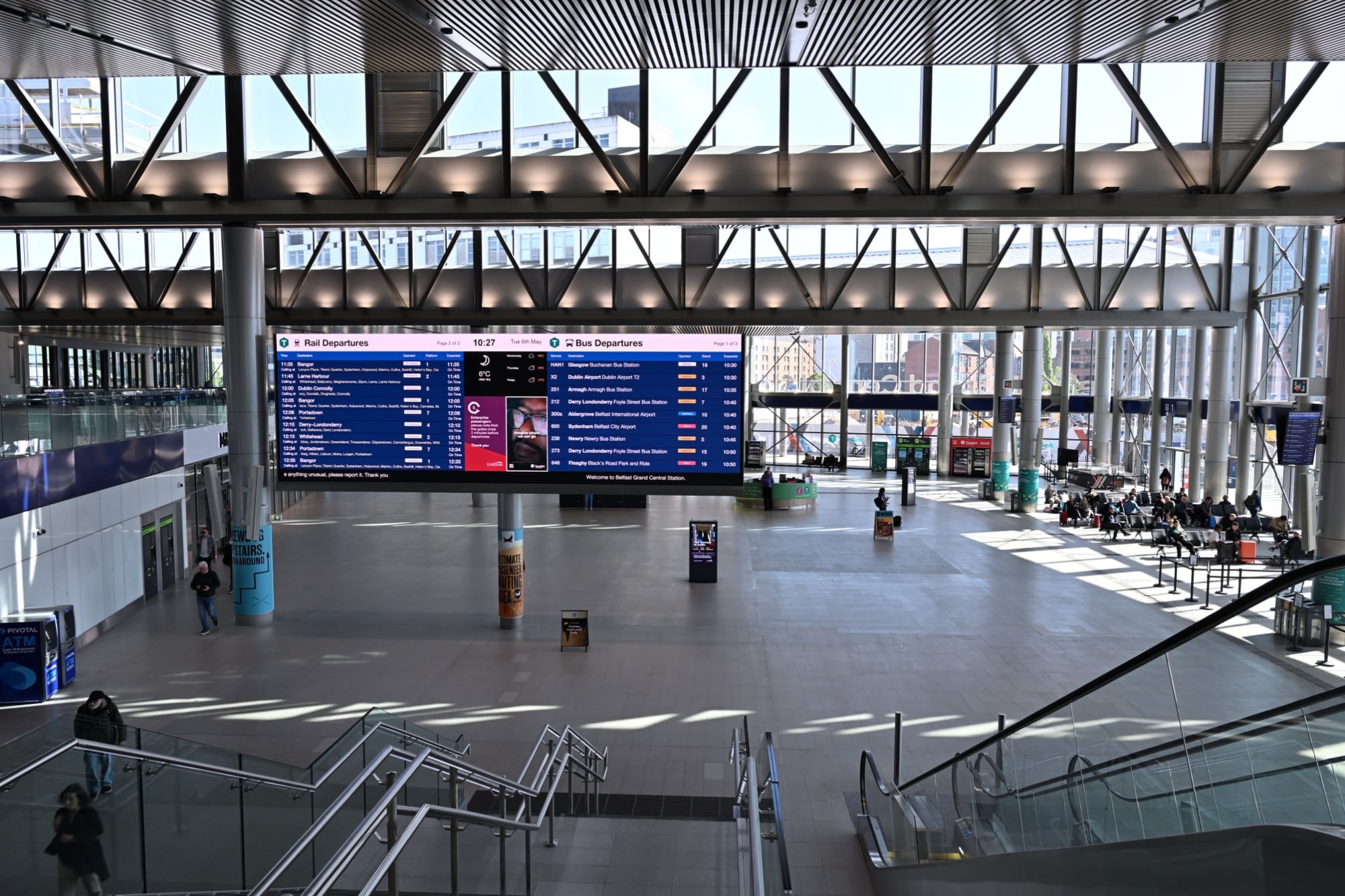 The concourse at Belfast Grand Central Station with combined rail and bus departure boards