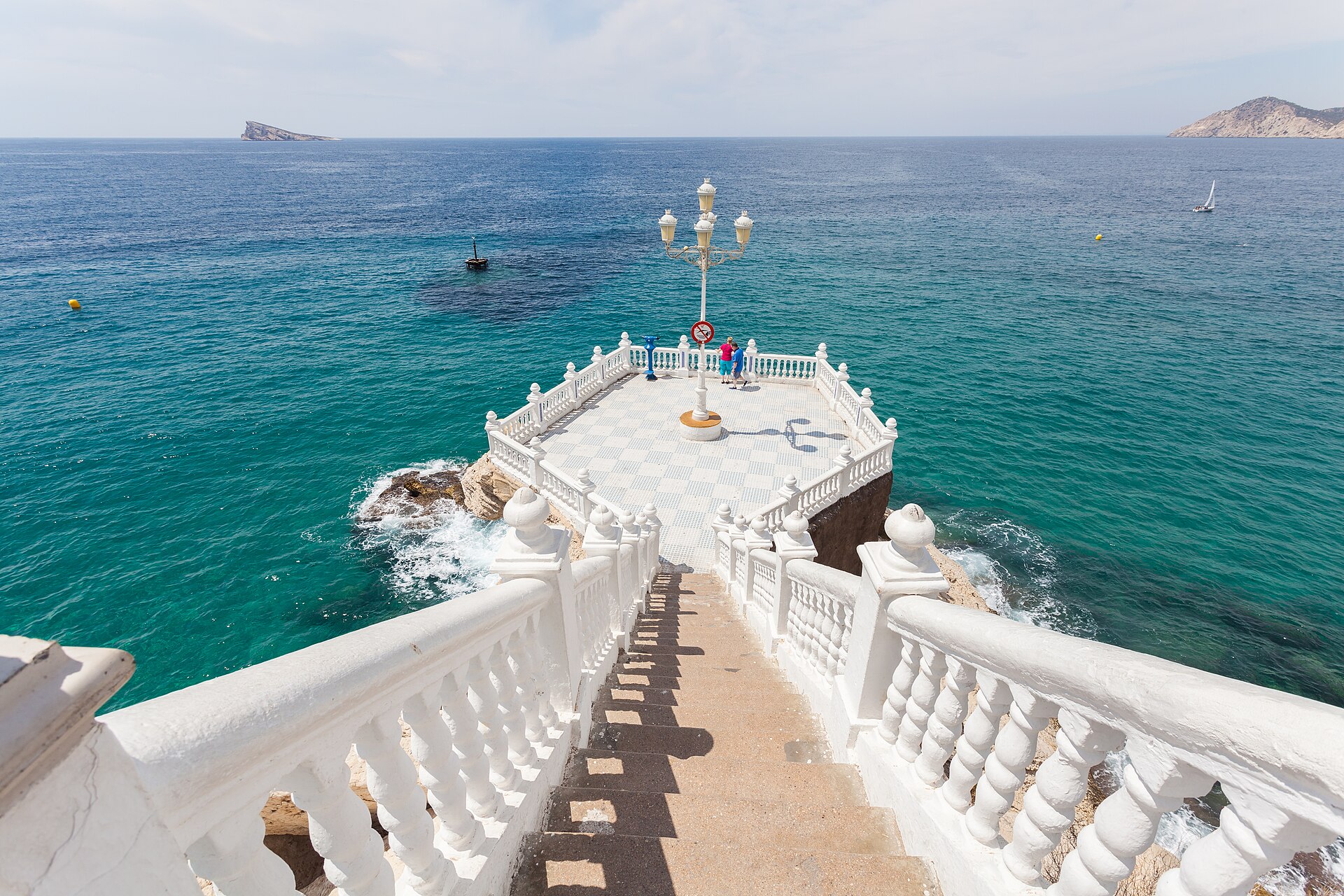 The white balustrades and steps of the Balcon del Mediterraneo viewpoint in Benidorm's Old Town above a blue sea