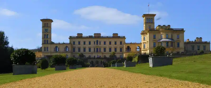 Osborne House’s yellow façade and towers above the terrace garden