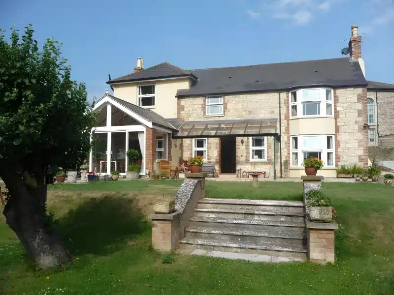 Front garden steps leading towards Ivy Hall’s sunroom and entrance