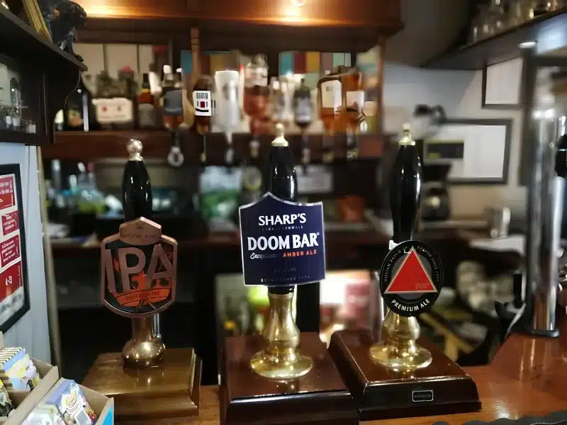 Beer taps at the bar, including a Sharp's Doom Bar pump.