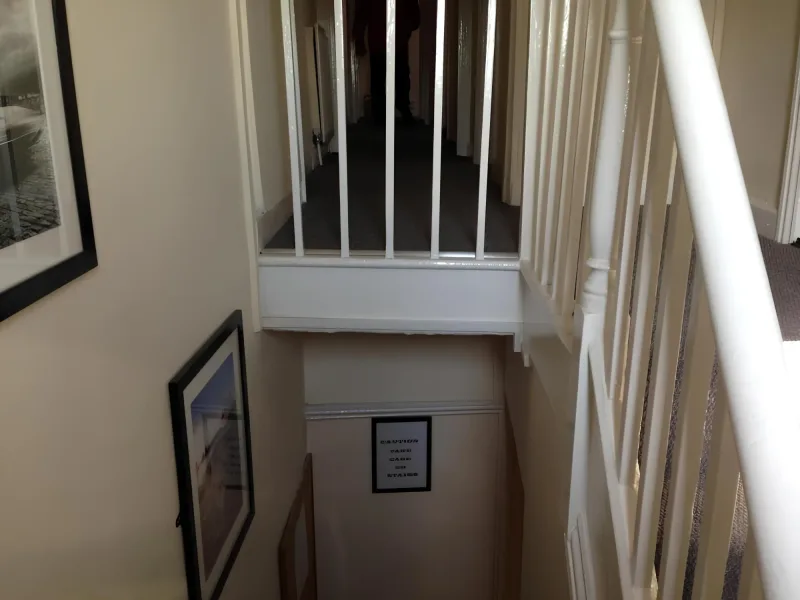 Stairs and landing leading to the upstairs accommodation