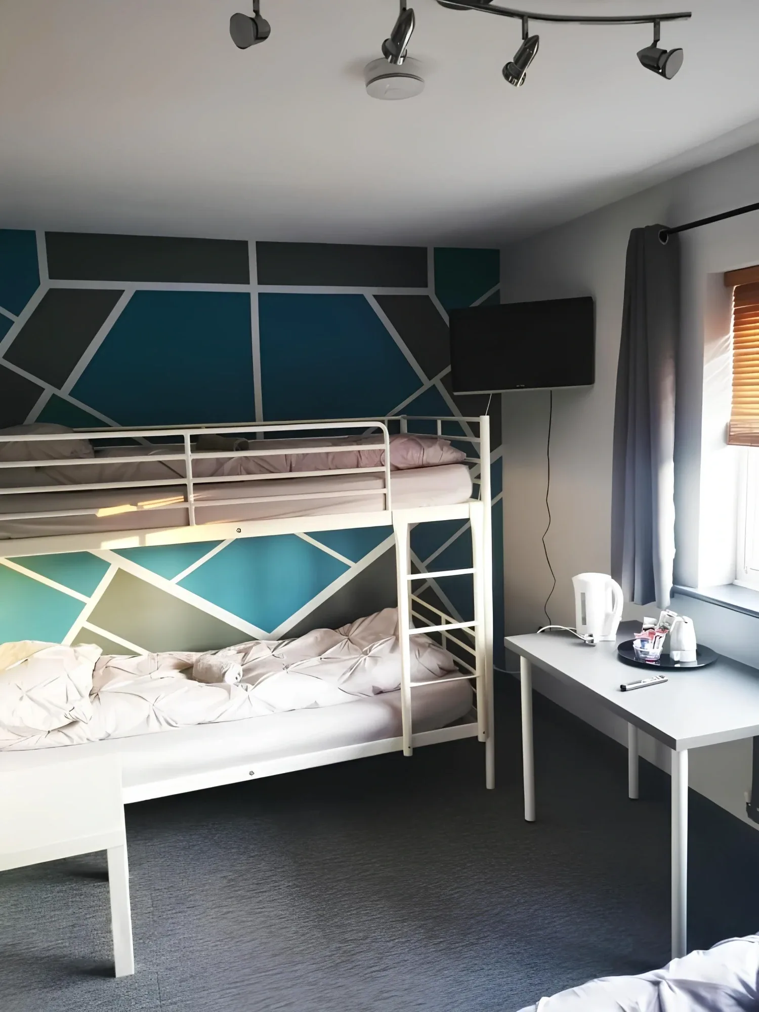 Bunk bed and desk in the Family Room with Private Bathroom