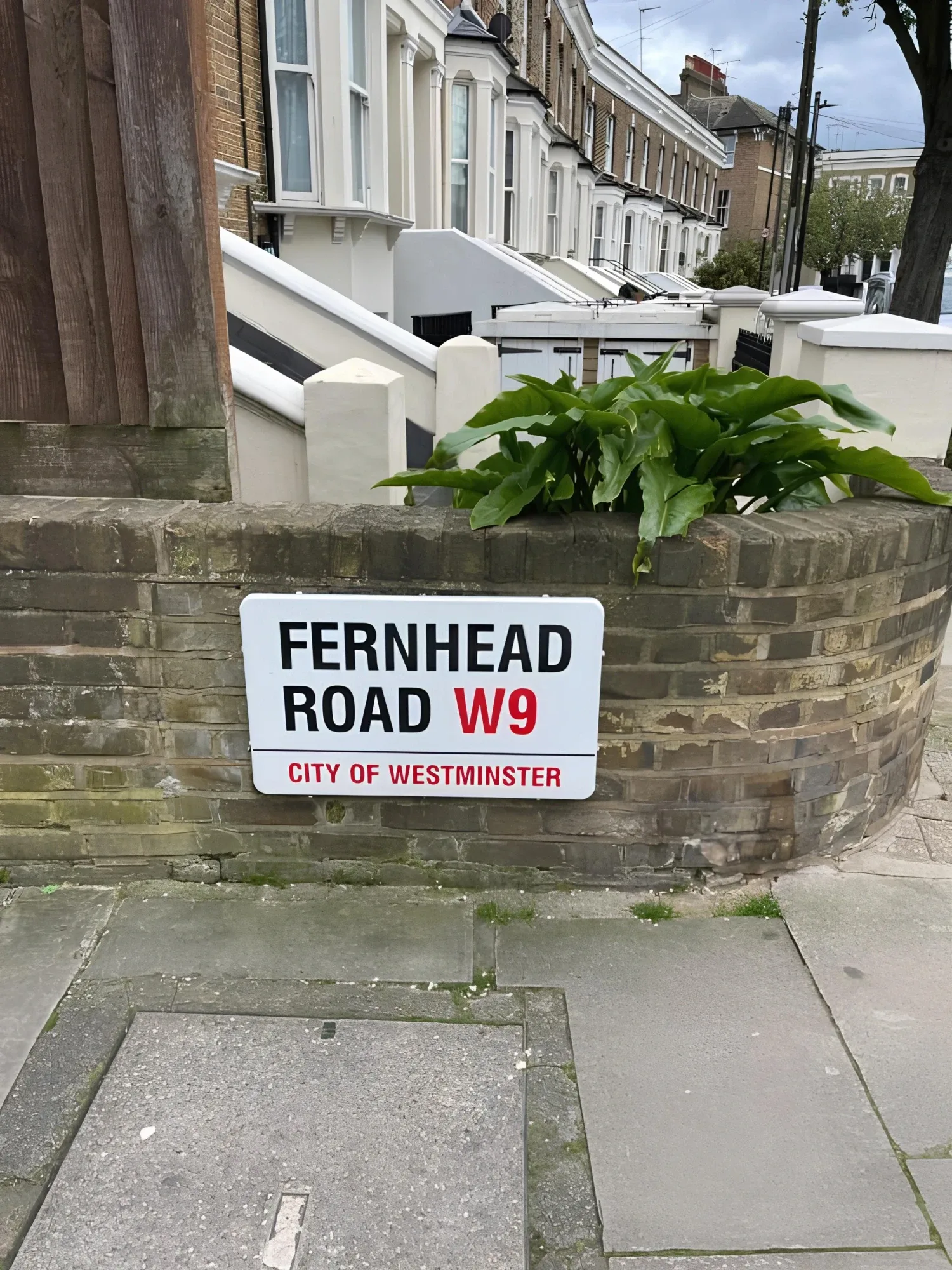 Fernhead Road street sign and brick houses in the property-supplied photograph
