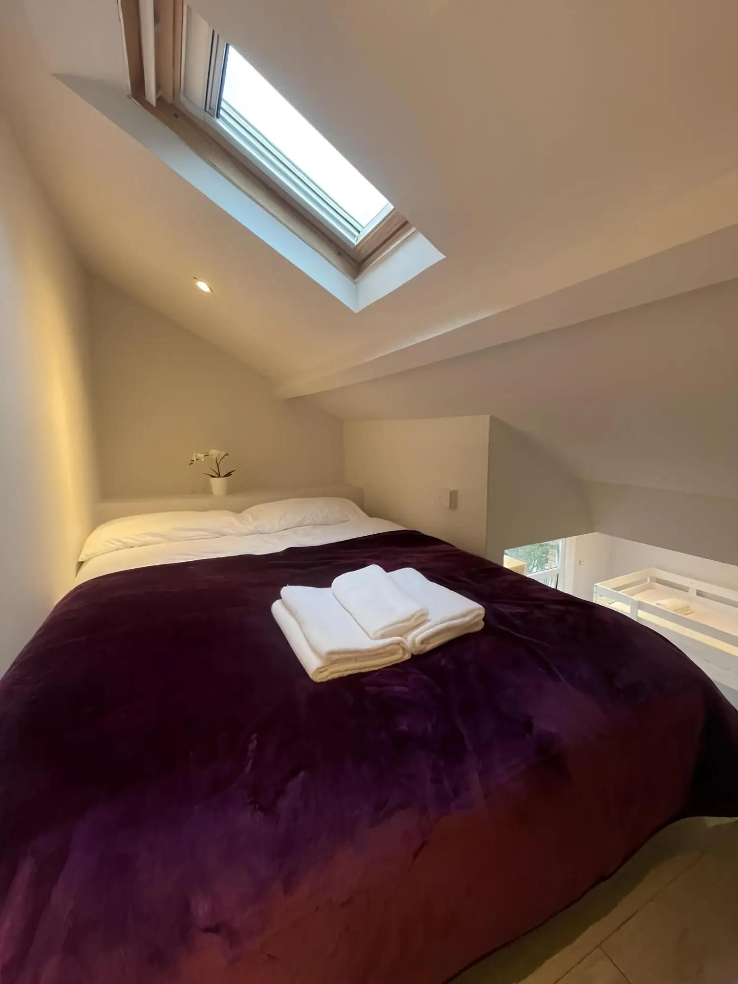 Raised double sleeping area in the Family Studio