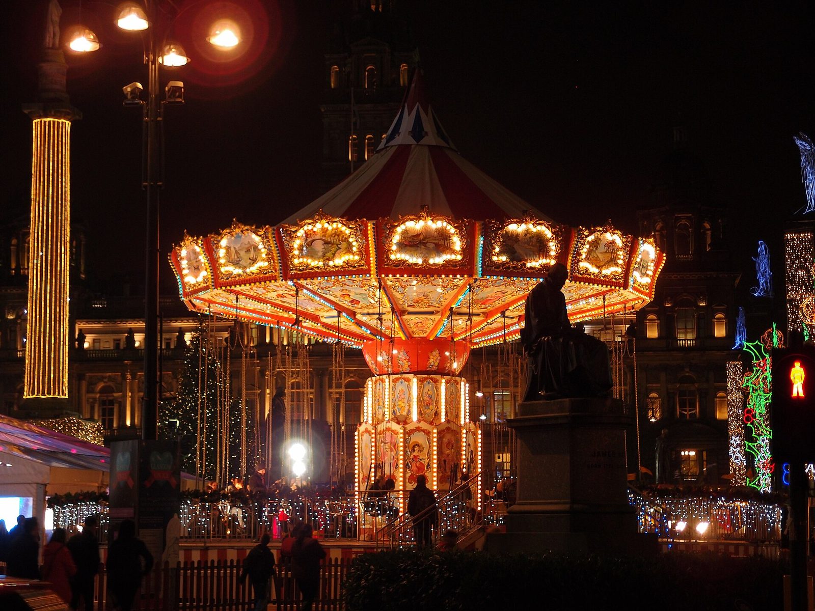 Illuminated fairground ride in George Square, Glasgow